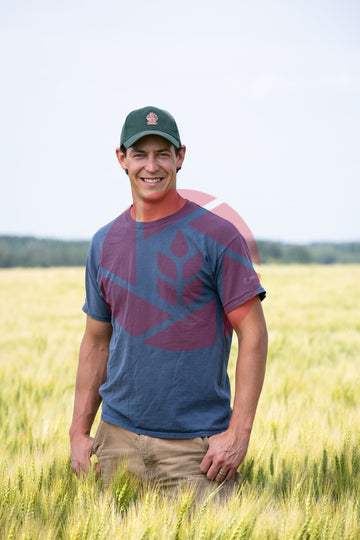 Farmer standing in a wheat field